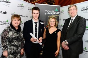 Craig Smallwoods, managing director of Lisneal College's "Custom" is presented with a certificate of participation in the Company Programme by Sharon Polson (Invest NI). Included are Maria Doran (Young Enterprise Ambassador) and Education Minister John O'Dowd.