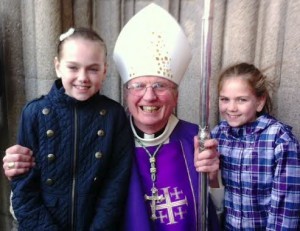 New Bishop of Derry Most Rev Dr McKeown with St Anne's PS Pupils Holly and Teaghan.