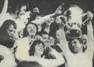 Harps captain Jim Sherian lifts the FAI Cup.