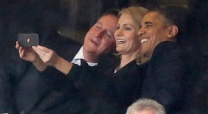 US President Barack Obama, Danish Prime Minister Helle Thorning-Schmidt and British Prime Minister David Cameron share a "selfie" at the memorial service to Nelson Mandela in Johannesburg.