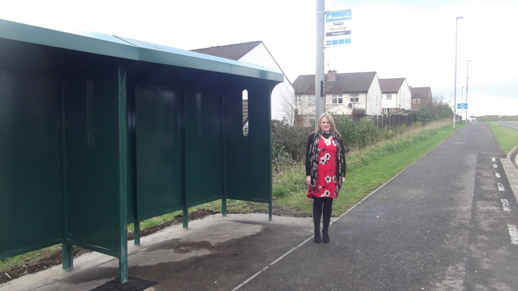 Sinn Fein election candidate at the newly erected bus shelter.