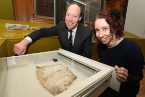 Bernadette Walsh, Archivist, Derry City Council’s Heritage and Museum Service with Edward Montgomery, The Honourable The Irish Society at the History of the Ulster Plantation Exhibition in the Guildhall with a page from the Great Parchment book 1639. Photo: Lorcan Doherty