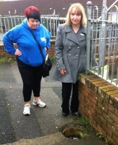 Cllr Karina Carlin beside one of the uncovered drains.