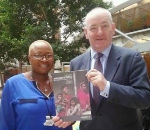 Foyle MP Mark Durkan with Aminata Koroma from the Ministry of Health and Sanitation in Sierra Leone showcasing a new report on acute malnutrition.