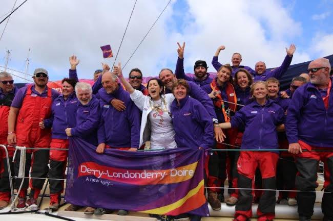 Derry Mayor Brendan Stevenson celebrates with the Derry Clipper crew on its arrival at Foyle Marina,