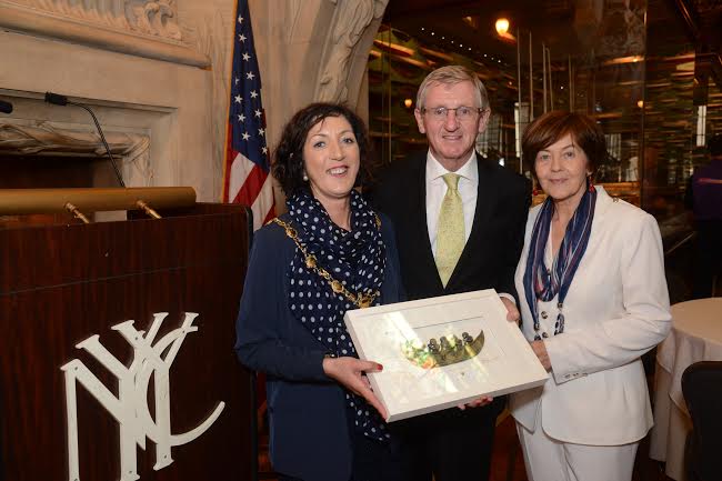 Derry Mayor, Cllr Brenda Stevenson, presenting a plaque to Noel Kilkenny, Irish Consul General of New York and his wife Hanora Kilkenny at an event in New York held to engage with businesses and key members from Northern Ireland diaspora in New York. 