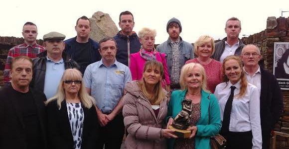 Sinn Fein MEP Martina Anderson making a presentation to the Craig family at last night's commemoration ceremony in Shantallow.