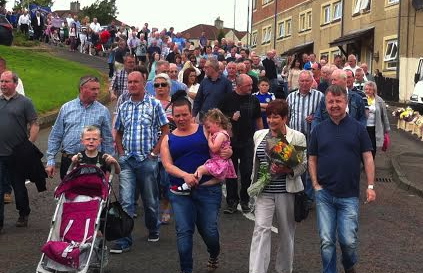 The parade making its way into Derry City Cemetery.