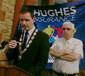 Deputy Mayor of Derry, Alderman Gary Middleton, speaking in Guildhall Square. Included is Michael Hutton, chairman, Foyle Cup.