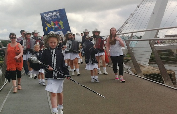 The Buncrana Accordion Band leading the parade across the Peace Bridge,.