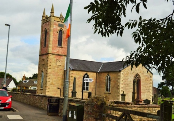 A tricolour flying next to the Church of Ireland church on Dungiven's Main Street.