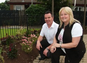 Linda Watson, Caw/Nelson Drive Community Group, with Liam Lynch, grounds supervisor with the Northern Ireland Housing Executive.