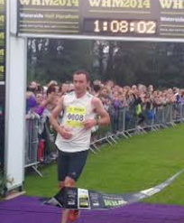 Gary Murray crosses the finish line to take first place.