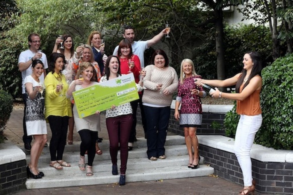  Maria Doherty breaks open the champagne as the Forward Emphasis workers celebrate collecting their €4.8m Lottery jackpot.