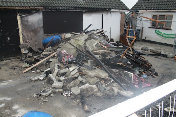 The rear of the house next door following the blaze.