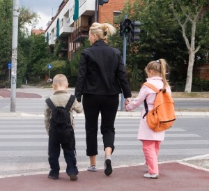 kids-walking-to-school-with-parent