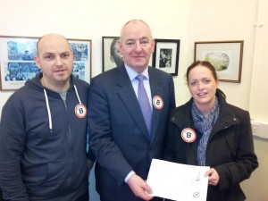 Foyle MP Mark Durkan with Emma and Darren Cowey, from Tullyally, who lost their infant son, Jamie, to Meningitis B.