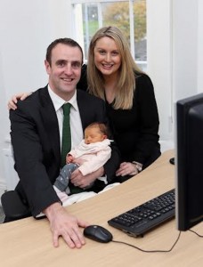 Environment Minister Mark H. Durkan at his desk with wife, Anne, and 9-day-old baby daughter, Lily. Photo Lorcan Doherty Photography