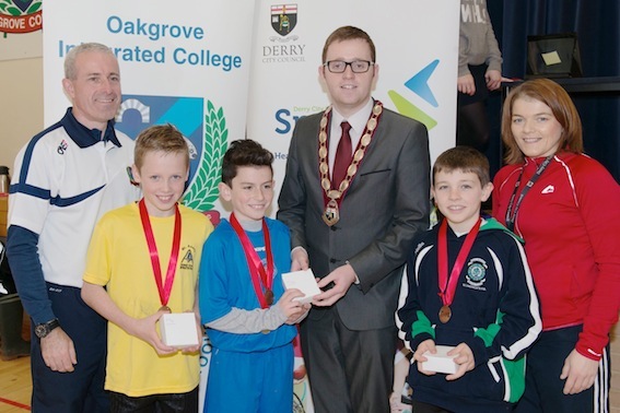 Aodhan Friel, Oakgrove, winner of the boys race, with Oisin Gallagher,St Annes, runner-up and  Oisin Colhoun, St. Patrick's, third. Included are Deputy Mayor Ald Gary Middleton, Cathal Donaghy, Oakgrove Integrated College and Rosie O'Brien, Derry City Council.