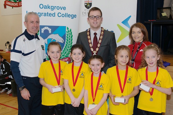 St Anne's Primary School, second in the overall girls team event. Included are Deputy Mayor Ald Gary Middleton, Cathal Donaghy, Oakgrove Integrated College and Rosie O'Brien, Derry City Council.