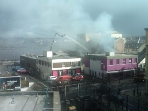 Fire crews on an elevated platform tackling the blaze at the Mandarin Chinese restaurant this afternoon