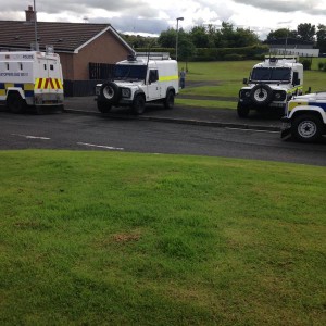 Police landrovers Ederowen Park, Gallaigh today where a search was  carried out of a house under the Terrorism Act