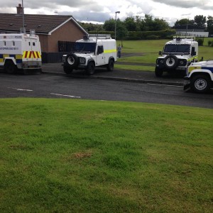 Police landrovers Ederowen Park, Gallaigh today where a search was carried out of a house under the Terrorism Act