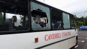 Broken windows in the coach which was stoned during sectarian attack