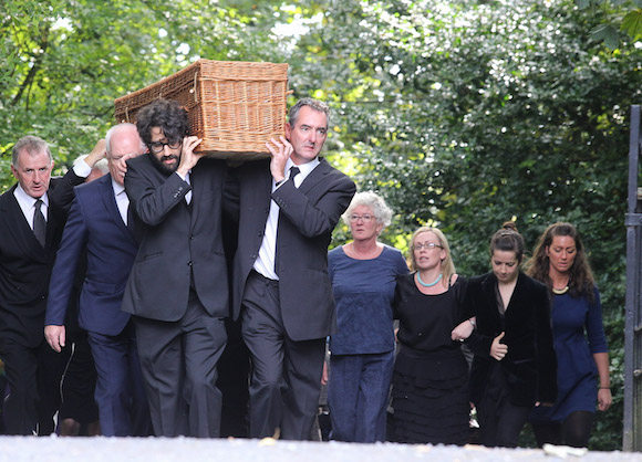 The remains of playwright Brian Friel is taken from his home at Greencastle. PIC BY NORTHWEST NEWSPIX