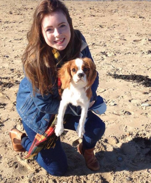 Leona Reid in happier times with her pet dog on the beach