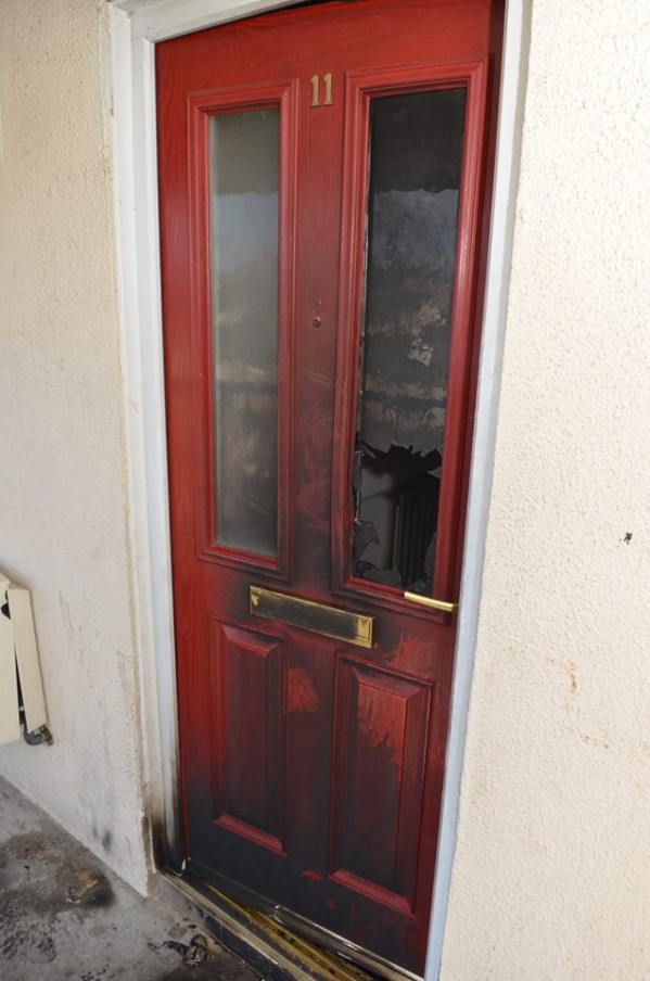 The scorched exterior door of the property at Kennaught Terrace in Limavady following an arson attack at the weekend
