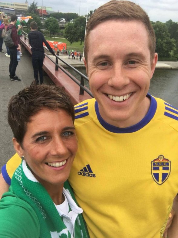 ALL SMILES FOR THE CAMERA...Derry woman Carmel McConnellogue with the Swedish fan after reuniting him with his lost ticket