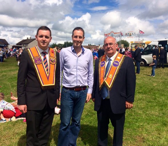 DUP' MLA Gary Middleton, Minister Paul Givan and former DUP Assembly Speaker Lord Hay of Ballyore at Orange field in Limavady