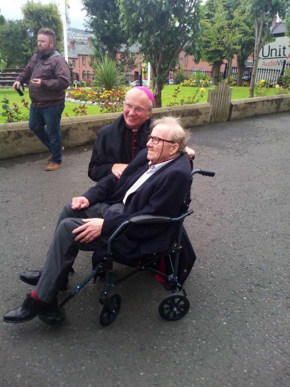 Former civil rights found Ivan Cooper greated by Bishop of Derry Donal McKeown as he arrives this afternoon for funeral of Bishop Edward Daly