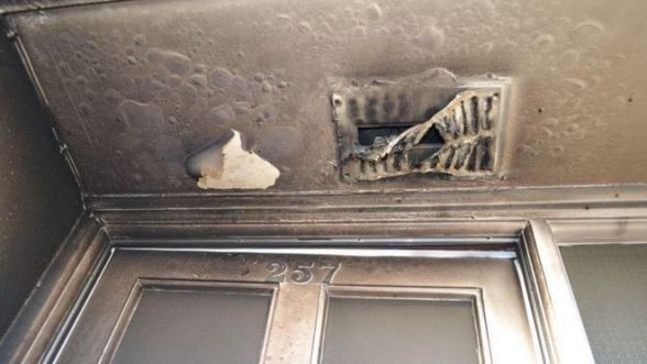 The charred ceiling in the hall of Katie Greer's Nelson drive home after arson attack