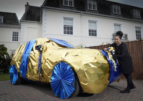 Neelam Meecha shows how to gift wrap a Range Rover at the EuroMillions Millionaire Academy
